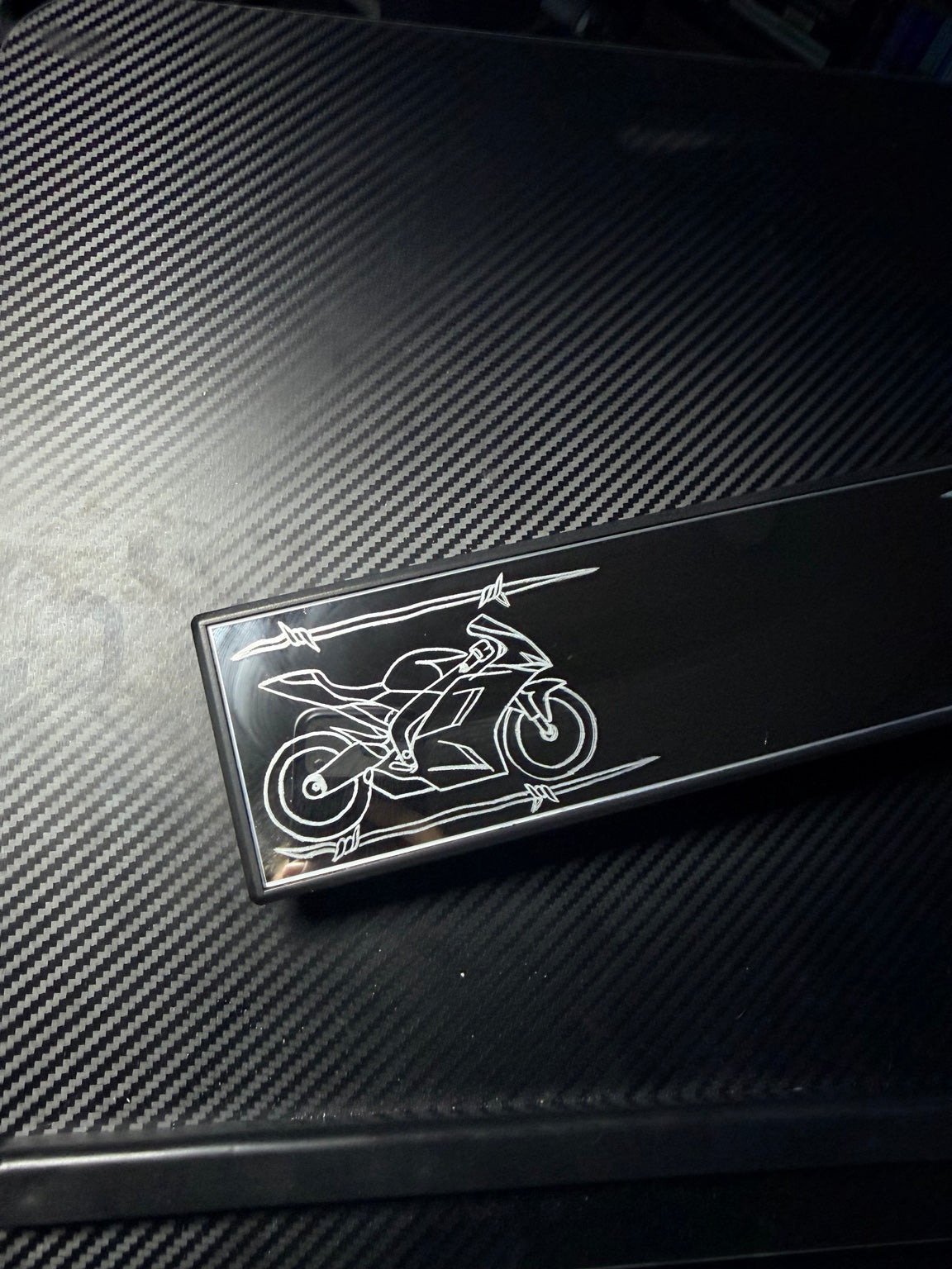 Hand-engraved sportbike close-up