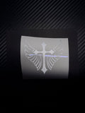 Custom cross-and-wings vinyl decal example on backing paper