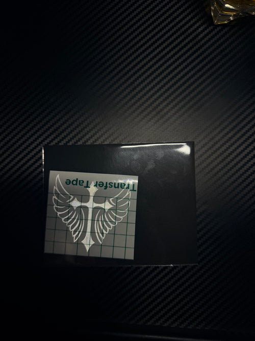 Custom cross-and-wings decal with transfer tape and packaging