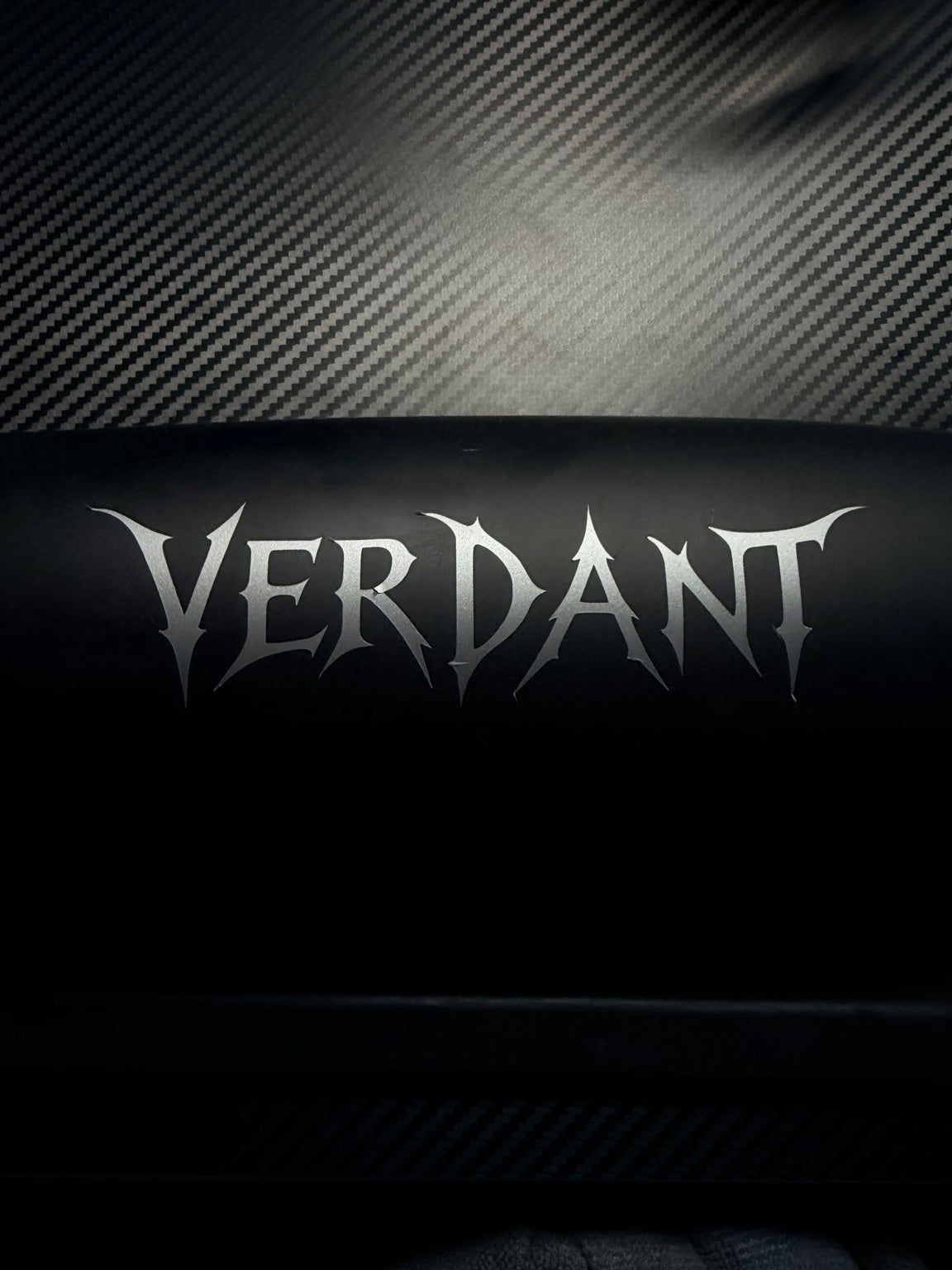 Silver VERDANT vinyl wordmark decal on a black background
