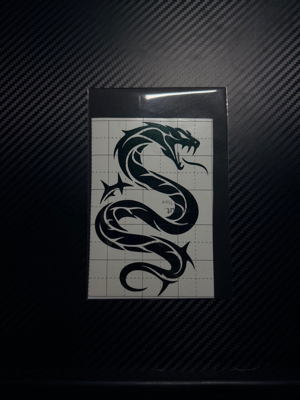 Serpent vinyl decal in clear protective packaging